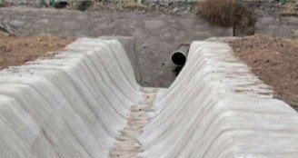 Ditch built with Swiftcrete concrete rolls.